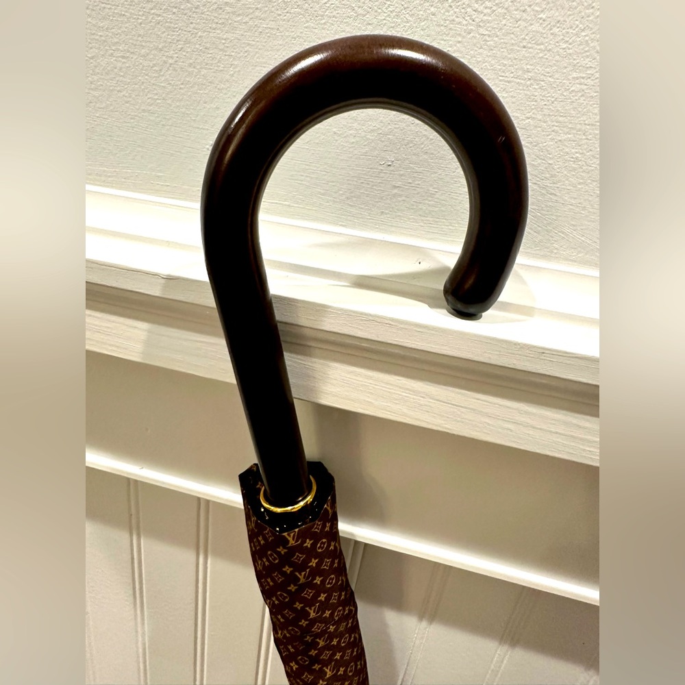 Authentic Louis Vuitton Umbrella with cover and gold hardware.